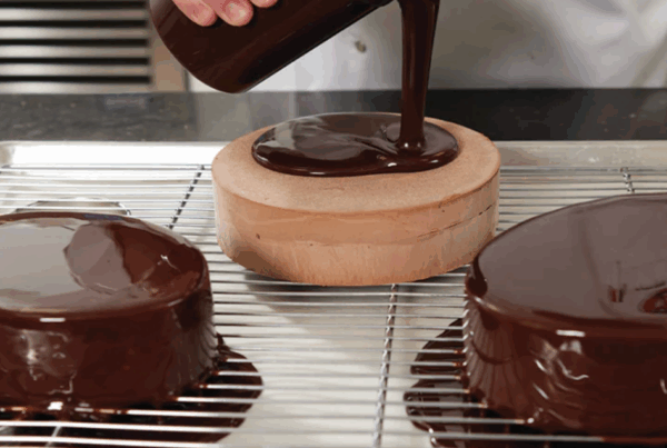 Cacao Noel chocolate being poured by pastry chef